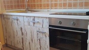 Apartment, 1 Double Bed | Private kitchen | Stovetop, cookware/dishes/utensils - Apartments Brizić (Bol)