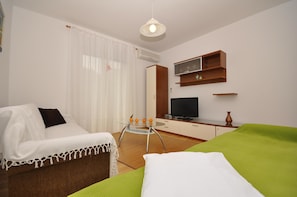 Appartement, Plusieurs lits | Cuisine privée | Un four