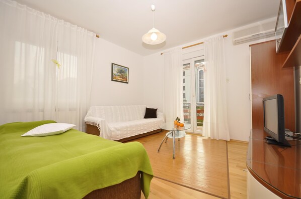 Apartment, Mehrere Betten | Wohnzimmer