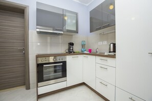 Appartement, Plusieurs lits | Cuisine privée | Surface de cuisson, lave-vaisselle