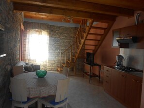 Departamento, varias camas | Cocina privada | Parrilla de estufa 