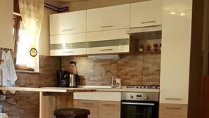 Apartment, Multiple Beds | Private kitchen | Coffee/tea maker, microwave, stovetop, toaster - Apartments Resanović (Fazana)