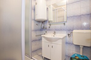 Apartment, 1 Double Bed with Sofa bed | Bathroom | Shower, hair dryer, towels