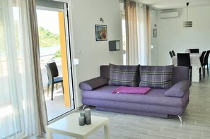 Apartment, Mehrere Betten | Wohnzimmer