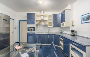 Apartment, Multiple Beds | Private kitchen