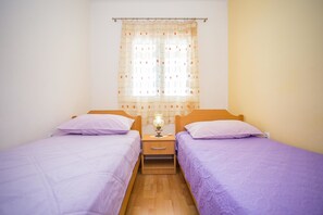 Appartement, Plusieurs lits | Accès au Wi-Fi (inclus), literie fournie