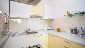 Apartment, Multiple Beds | Private kitchen | Oven, stovetop, cookware/dishes/utensils - Apartments Vuković (Okrug)