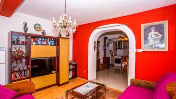 Apartment, Multiple Beds | Living room | TV