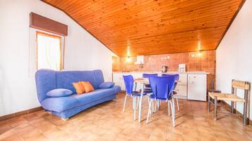 Apartment, Multiple Beds | Living room | TV