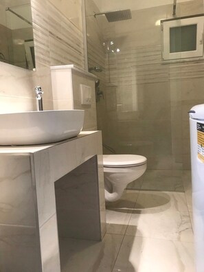 A bathroom with a marble sink, a toilet, and a shower enclosure. - Apartments Jakov / Two Bedroom (Solta)