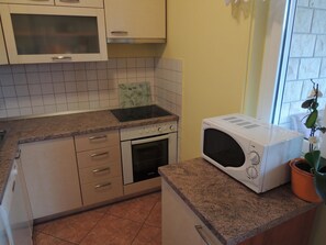 Apartment, Multiple Beds | Private kitchen