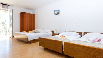 Apartamento, várias camas | Wi-Fi de cortesia, roupa de cama