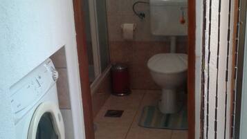 Apartment, 2 Double Beds | Bathroom | Shower, hair dryer, towels