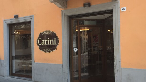 A storefront with a sign reading "Carini" and a number "18" above the entrance. - B&B Treviglio (Treviglio)