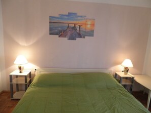 Departamento, 2 camas matrimoniales | Cocina privada | Parrilla de estufa y utensilios de cocina 