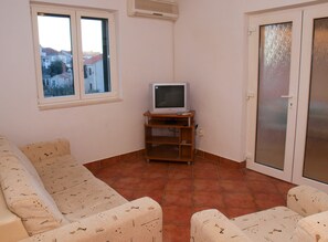 Apartment, Mehrere Betten | Wohnzimmer