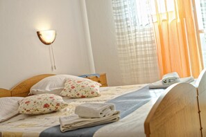 Appartement, Plusieurs lits | Accès au Wi-Fi (inclus), literie fournie