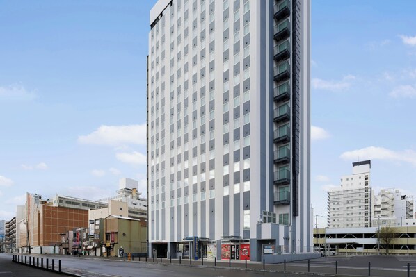 A tall, modern hotel with a grid of windows and balconies. - Four Points Flex by Sheraton Hakodate Station (Hakodate)