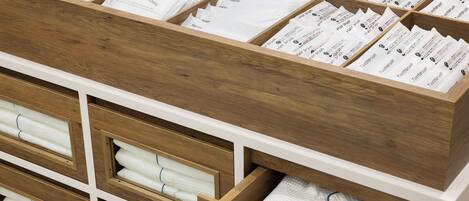A storage area with neatly organized compartments containing various toiletries.