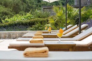 Seasonal outdoor pool, pool loungers