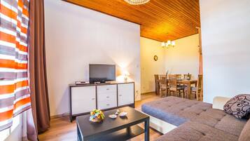 Apartment, Multiple Beds | Living room | TV