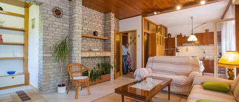 Apartment, Multiple Beds | Living room | Flat-screen TV