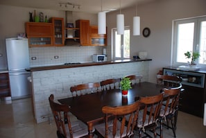 House, Multiple Beds | Private kitchen