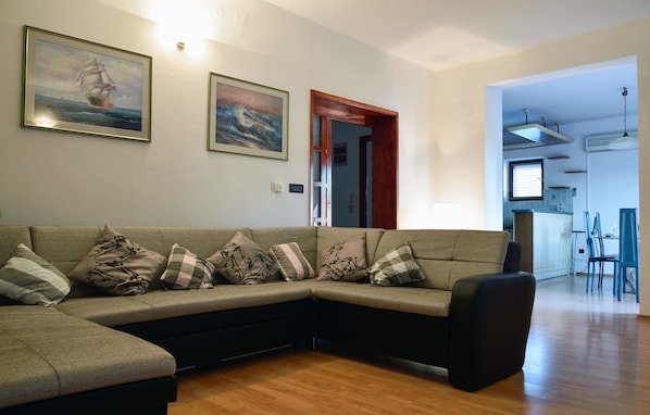 Apartment, Multiple Beds | Living room | TV