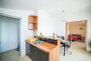 Appartement, Plusieurs lits | Accès au Wi-Fi (inclus), literie fournie