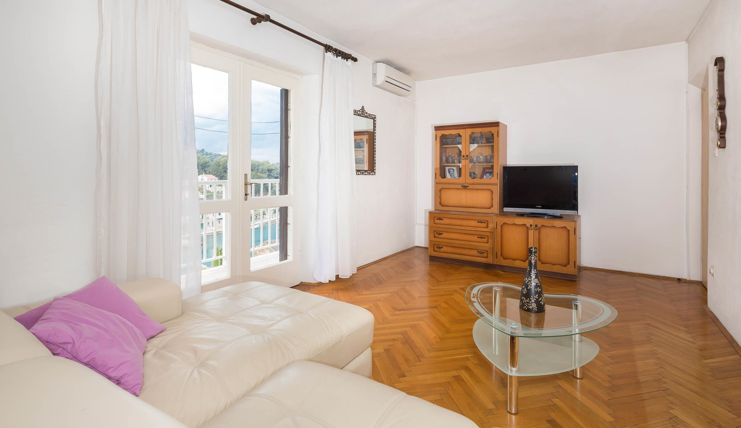 Apartment, Multiple Beds | Living room | TV