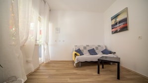Appartement, Plusieurs lits | Accès au Wi-Fi (inclus), literie fournie