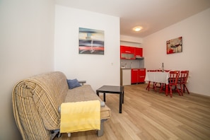 Apartment, Multiple Beds | Living room | TV