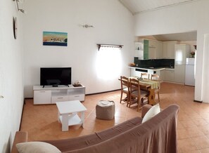 Apartment, Multiple Beds | Living room | TV