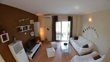 Apartment, Multiple Beds | Living room | TV