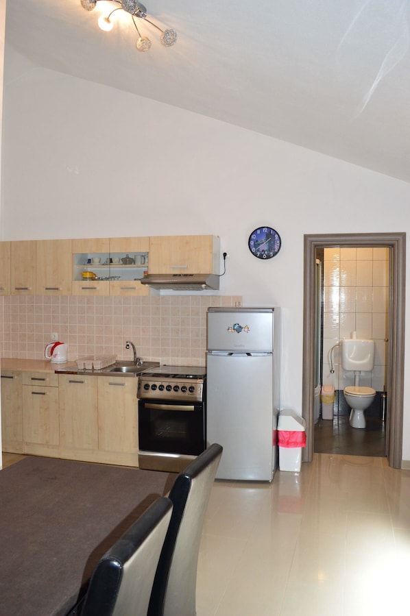 Apartment, 2 Double Beds | Private kitchen | Oven, stovetop, coffee/tea maker, cookware/dishes/utensils