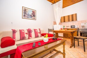 Apartment, Multiple Beds | Living room | TV