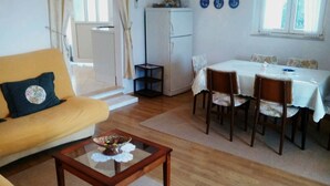 Apartment, Multiple Beds | Living room | TV