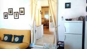 Apartment, Multiple Beds | Living room | TV