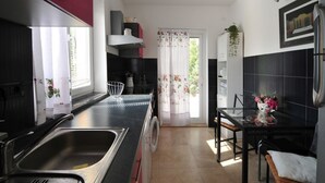 Apartment, Multiple Beds | Private kitchen | Oven, stovetop, dishwasher, cookware/dishes/utensils