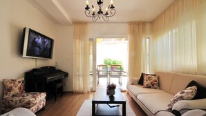 Apartment, Multiple Beds | Living room | TV