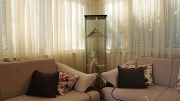 Apartment, Multiple Beds | Living room | TV