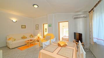 Apartment, Multiple Beds | Living room | TV