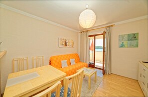 Apartment, Multiple Beds | Living room | TV