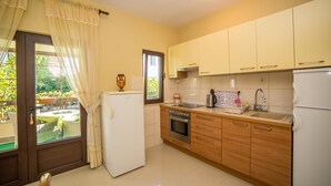 Apartment, Multiple Beds | Private kitchen | Stovetop, cookware/dishes/utensils - Apartments Protega (Okrug)