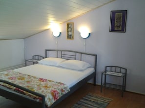 Departamento, 2 camas matrimoniales | Cocina privada | Parrilla de estufa y utensilios de cocina 