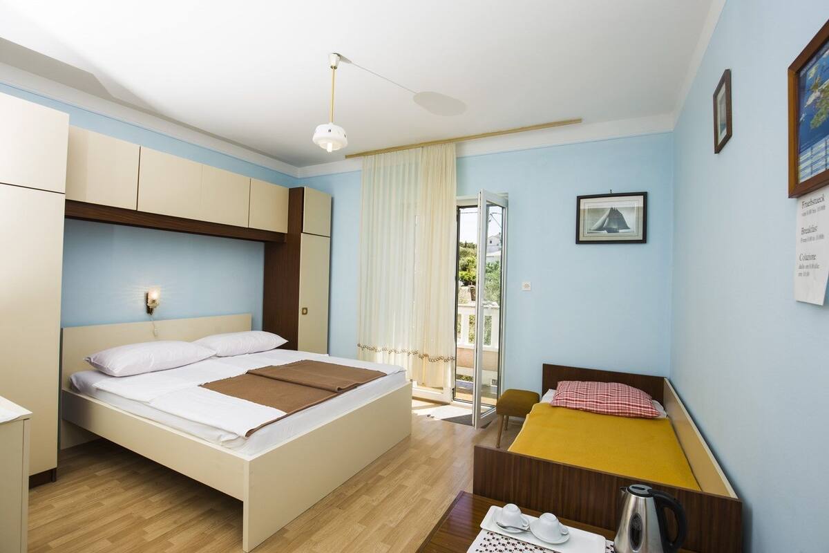 Quarto, várias camas | Wi-Fi de cortesia, roupa de cama