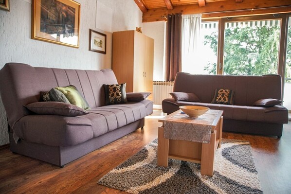 Apartment, Multiple Beds | Living room | TV