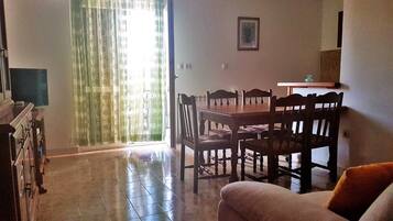 Apartment, Multiple Beds | Living room | TV