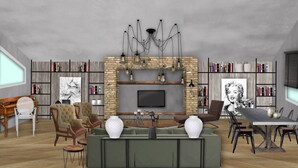 Un salon spacieux doté d’une cheminée, de bibliothèques, d’un téléviseur et de sièges confortables.