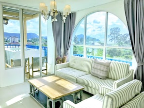 2 Bedroom Suite Jacuzzi | Living room | Flat-screen TV